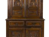 an old wooden cabinet with carvings and carvings on the doors