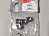 a bag of silver metal parts on a white surface