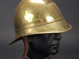 a gold helmet on a mannequin head