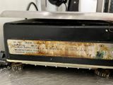 a close up of a toaster on a table