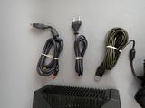 a lot of wires and a charger on the table