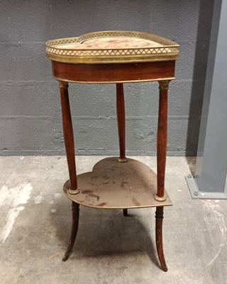 a small wooden table with a shelf on it