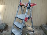 a ladder that is leaning against a building