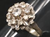 a close up of a ring with a flower design on it