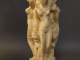 a pair of carved ivory figurines of hindu deities