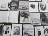 a lot of drawings that are on the table