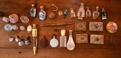 a wooden table with a lot of glass items on it