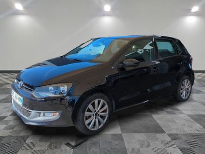 the volkswagen e - golf is parked in a garage with a checkered floor