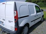 a white van that is parked on the side of the road