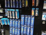 many toothbrushes and toothpaste on display in a store
