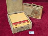 a small wooden box with a radio inside of it