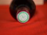 a bottle of wine that is sitting on a table