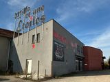 the building has a sign on it that says the building has a red star on it