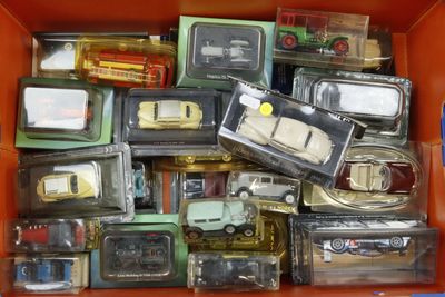 a box full of toy cars and trucks in it