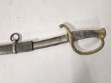 an image of a sword that is on a white surface