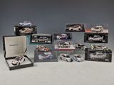 many different models of cars in a display case