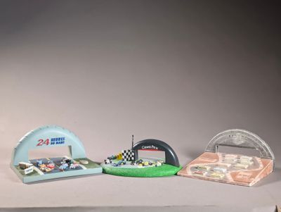three miniature cars that are sitting on top of a table