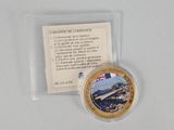 a small coin with a picture of a bridge on it