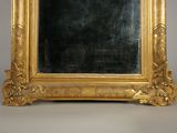 a picture of a gold frame with a mirror in it