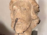 a statue of a man ' s head on a marble pedestal