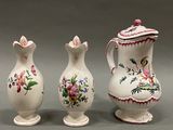 three vases that have been painted with flowers on them