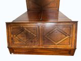 a wooden bed with a wooden headboard and foot board
