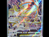 a close up of a pokemon card on a stand