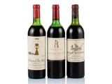 three bottles of wine sitting next to each other on a white surface