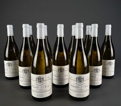 six bottles of wine are lined up in a row on a table