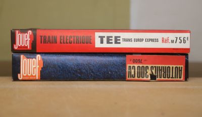 three books stacked on top of each other on a table