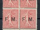 a stamp with four different images of a woman on it