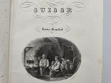 an open book with a picture of a group of people sitting in a room