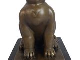 statue of a cat sitting on a marble base