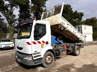 a dump truck that is parked on the side of the road
