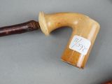 a cane with a sticker on it sitting on a table