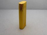 a small gold object that is on a table