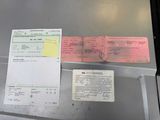 a passport and a receipt sitting on a table
