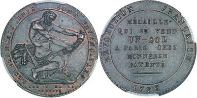 Gros plan sur une pièce de monnaie ornée d'une statue
