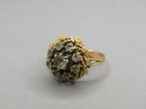 an image of a gold ring with a cluster of diamonds