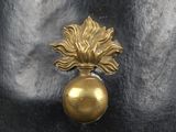 a close up of a metal object with a gold ball on it