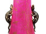 a pink vase with a gold design on it