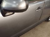a car that has a side mirror on the side of it