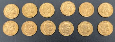 a close up of a bunch of gold coins on a black surface