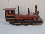 a toy train that is sitting on a white surface