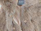 the jacket is made of faux and has a fur collar