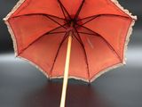 a red umbrella that is sitting on a table