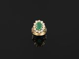 an emerald and diamond ring