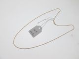 a close up of a necklace with a price tag attached to it