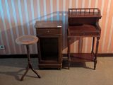 a small table and a small cabinet in a room