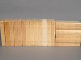 several books stacked on top of each other on a gray surface